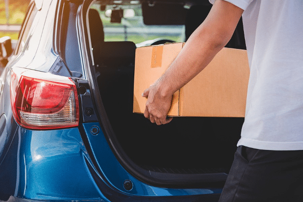 unloading box from car