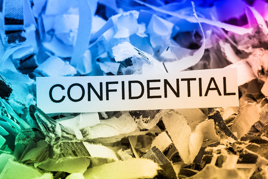 scraps of paper with the word confidential.